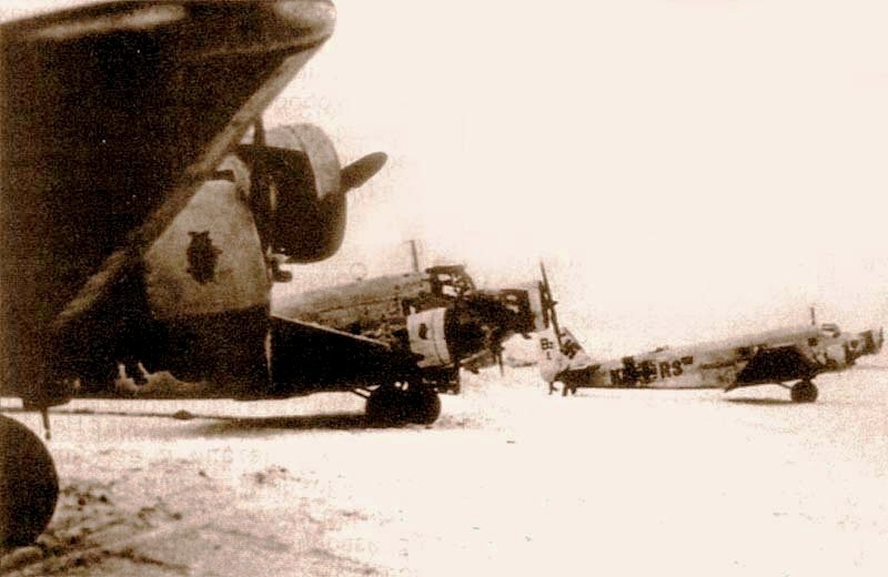 Junkers Ju 52 in Stalingrad pocket, repainted into white, are getting ready for a flight Junkers Ju 52 in Stalingrad pocket, repainted into white, are getting ready for a flight
