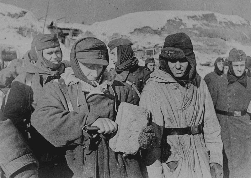 Captured Germans split bread, district of Stalingrad Captured Germans split bread, district of Stalingrad