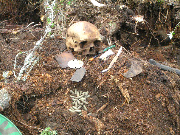 The bullet hole in right temple, a shell casing and a personal dog tag belong to Hans Romerud The bullet hole in right temple, a shell casing and a personal dog tag belong to Hans Romerud