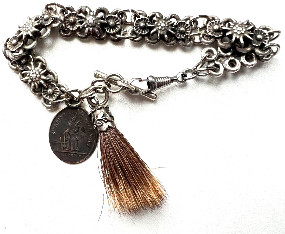 Chatelain with a Catholic pendant