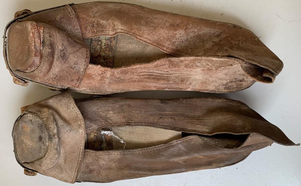 Three pairs of wooden shoes